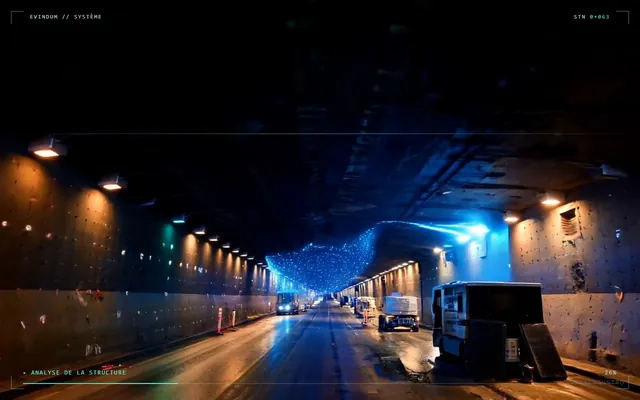 Écran réel du CV en ligne : en-tête EVINDUM système et photo d'un tunnel éclairé en chantier